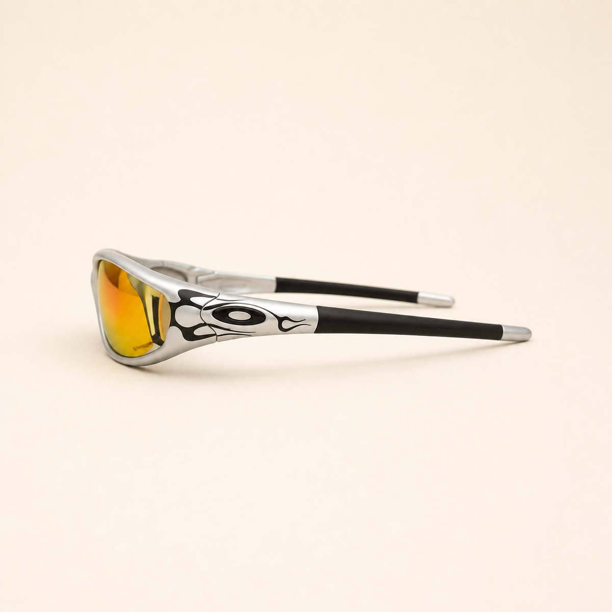Side profile of Oakley Minute Silver / Black Flames sunglasses with black flame temple graphics and black temple sleeves.