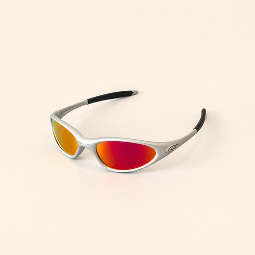 Oakley Minute silver sunglasses with red-orange mirrored lenses and black temple sleeves, three-quarter view.